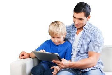 Young father and son using a digital tablet