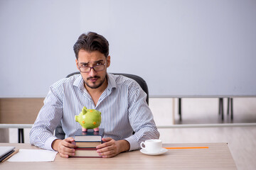 Fototapeta premium Young male teacher in retirement concept