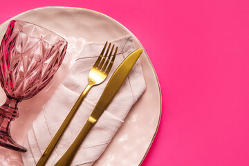 Stylish table setting on pink background