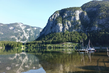 Beautiful views of mountains and lakes with a lakeside sailing marina.