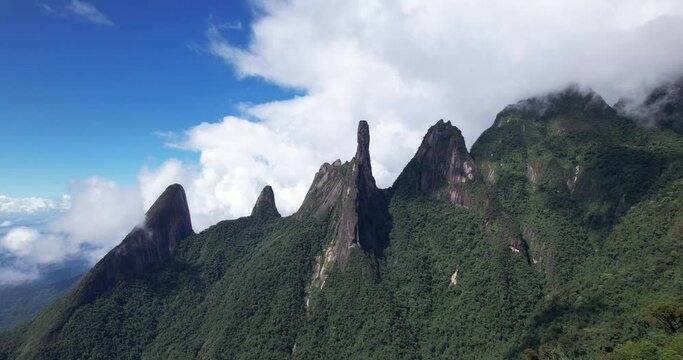 Aerial of clouds moving in over panorama landscape of mountain range Serra dos Orgaos in Teresopolis, Rio de Janeiro, Brazil