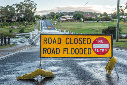 Road Closed Road Flood Sign In Front Of Flooded Road In Australia