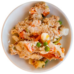 Banquet in the restaurant - Spanish salad with potatoes, tuna, olives and egg. Isolated over white background