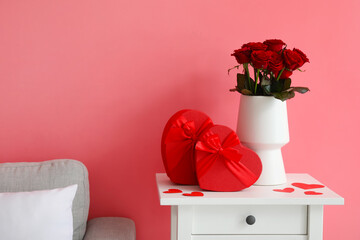 Gifts and rose flowers for Valentine's Day on table in room