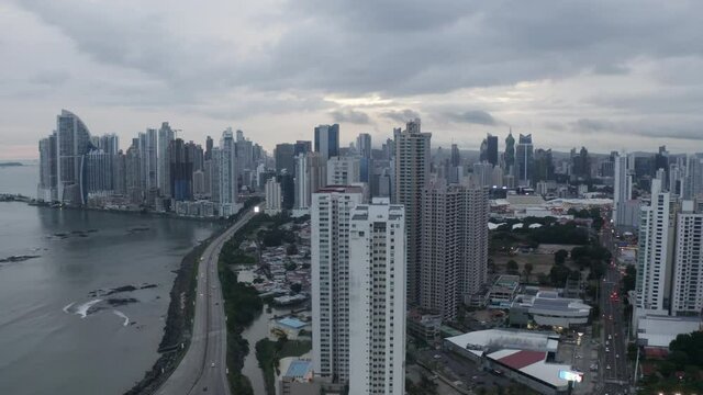 Aerial view of tall buildings in Panama city on a cloudy day, wide shot