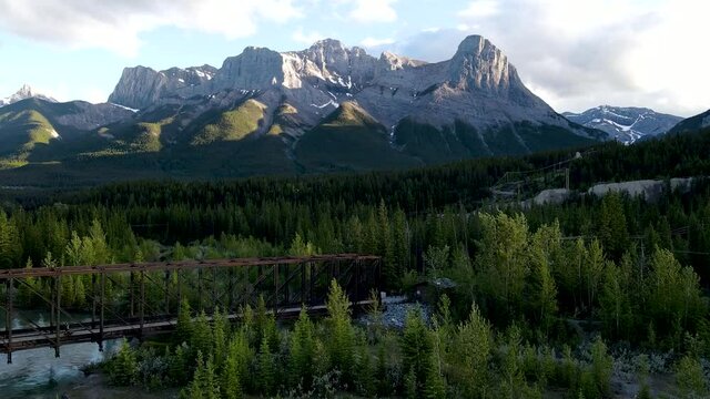 Drone shot toward mountain and bridge