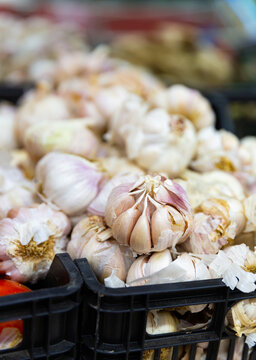 Garlic in a crate, put up for sale in a store. Close-up image