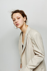 beautiful woman classic suit fashion posing fun light background unaltered