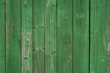 Background surface of natural wood with an old pattern in green and emerald. Texture
