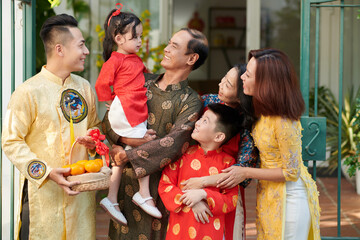 Happy three generation family dressed for Lunar New Year celebration