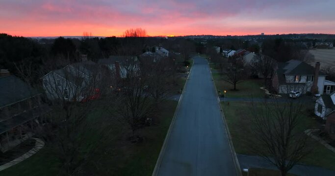 Beautiful Sunrise In USA Suburb Residential Development. Quiet Morning Aerial Above Street In America Suburbia.