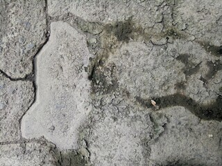 cracked and dirty brick paving roads
