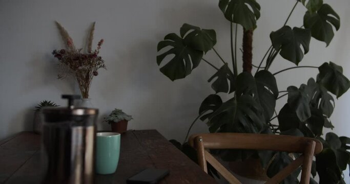 Girl puts phone down and leaves table to start in her day