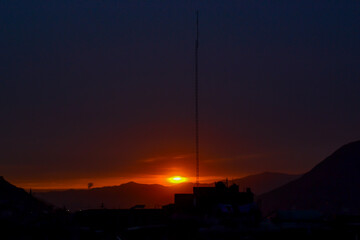 Sunset from an industrial and urban area.