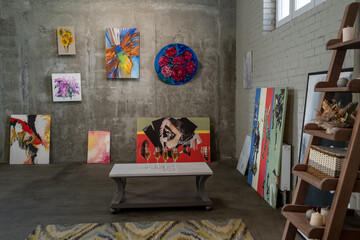 Collection of paintings of modern artists hanging on walls of gallery prepared for visitors before opening event