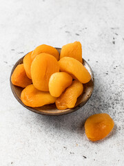 Dried apricots isolated on a light background.