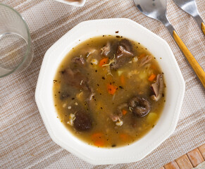 Thick mushroom soup with assorted vegetables and pork meat