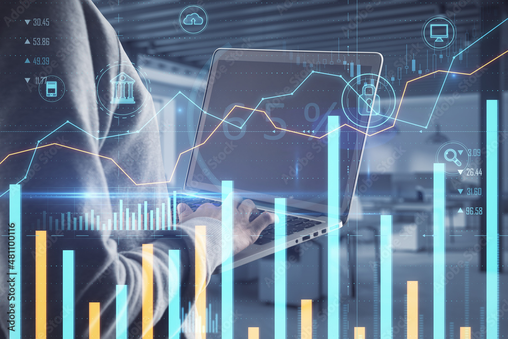 Poster hacker using laptop with creative glowing business chart on blurry office background. online banking
