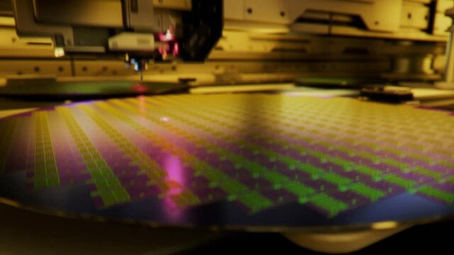 Macro Shot of Silicon Wafer being processed at Semiconductor Foundry, that produces Computer Chips. Macro Shot