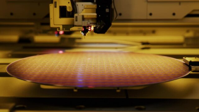 Shot of Silicon Wafer being processed at Semiconductor Foundry, that produces Computer Chips.