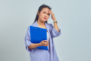 Portrait of depressed young Asian business woman holding document folder, feeling dizzy and severe...