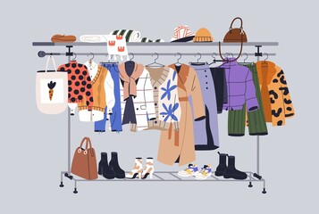 Women capsule wardrobe on racks. Fashion clothes on hanger rail. Autumn, winter apparels, shoes and accessories. Modern casual female garments collection hanging. Colored flat vector illustration