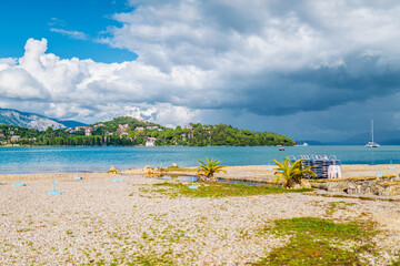 Pebble beach of Mediterranean sea bay against Corfu island