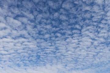 Fototapeta na wymiar Beautiful blue sky view of lovely small clouds.