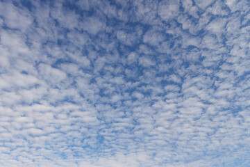 Beautiful blue sky view of lovely small clouds.