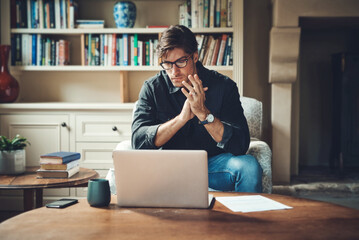 Conjuring up a plan for success. Shot of a handsome young businessman working on a laptop in his...