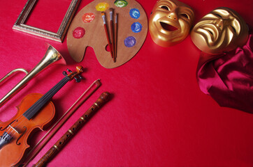 Attributes of arts.Music, painting, theater.Theatrical masks of comedy and tragedy,violin, flute,...
