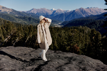 Naklejka premium tourist Standing on the edge of a cliff nature travel relaxation