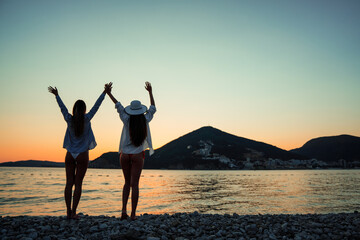 Fototapeta premium Women, friend having fun on the beach on summer vacation