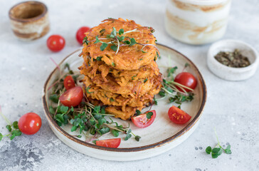 Vegan fritters with sweet potato and herbs on gray background. Vegetarian, clean eating, diet food. closeup, soft focus