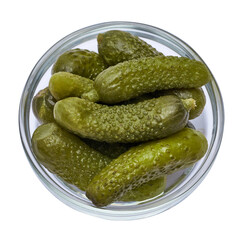 Bowl of Tasty canned Whole green cornichons isolated on a white background