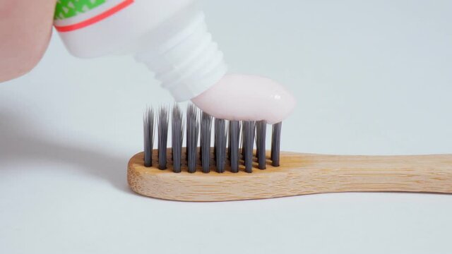Ecological toothbrush made from natural bamboo. Sustainable lifestyle concept, zero waste. White background