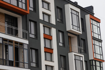Fragment of Modern residential apartment with flat buildings exterior. Detail of New luxury house and home complex. Part of City Real estate property and condo architecture. Copy space