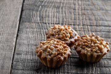Nutty tarts on rustic wooden table
