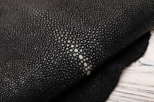 natural colored black rays leather on the wooden table