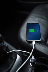 Mobile phone ,smartphone, cellphone is charged ,charge battery with usb charger in the inside of...
