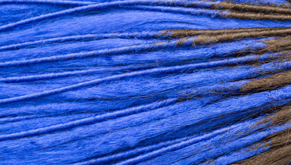 Dreadlocks close-up. Braided by a master hairdresser in the salon, hair braided in dreadlocks. African braids on a white background.