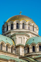 Fototapeta na wymiar Facade and domes, St Alexander Nevsky Cathedral, close up view of the golden dome of the church, Sofia, Bulgaria.