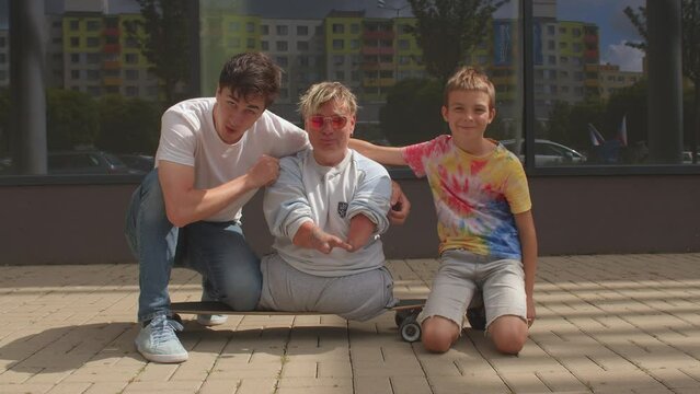 Portrait of happy disabled woman with friends. Congenital amputations. Amelia is absence of a limb, hemimelia is absence of the forearm or hand.