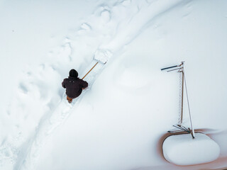 cleaning a passage in the snowdrifts