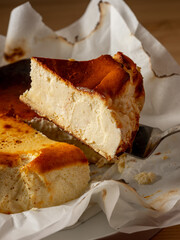 Piece of cake with cottage cheese cheesecake baked in oven. Sweet dessert for breakfast or coffee time in cafe - 481114702