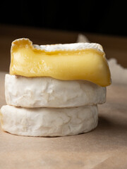 French cheese camembert or brie close up on wooden table. Food ingredient for snack, starter or appetiser  - 481114738