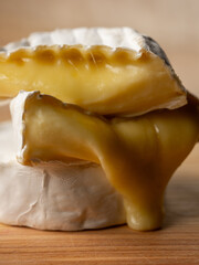 Tasty melted cheese camembert on wooden table close up, selective focus - 481114744
