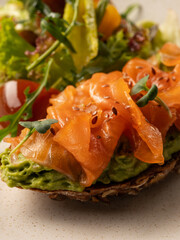 Sandwich with salmon fish slice and fresh salad closeup food photo  - 481114763