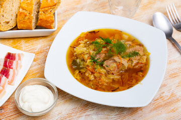 National dish of Russian cuisine is cabbage soup, cooked in thick broth and on the basis of sauerkraut with meat