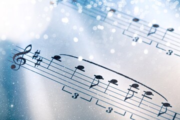 Christmas Music concept. Christmas lights on music sheets
